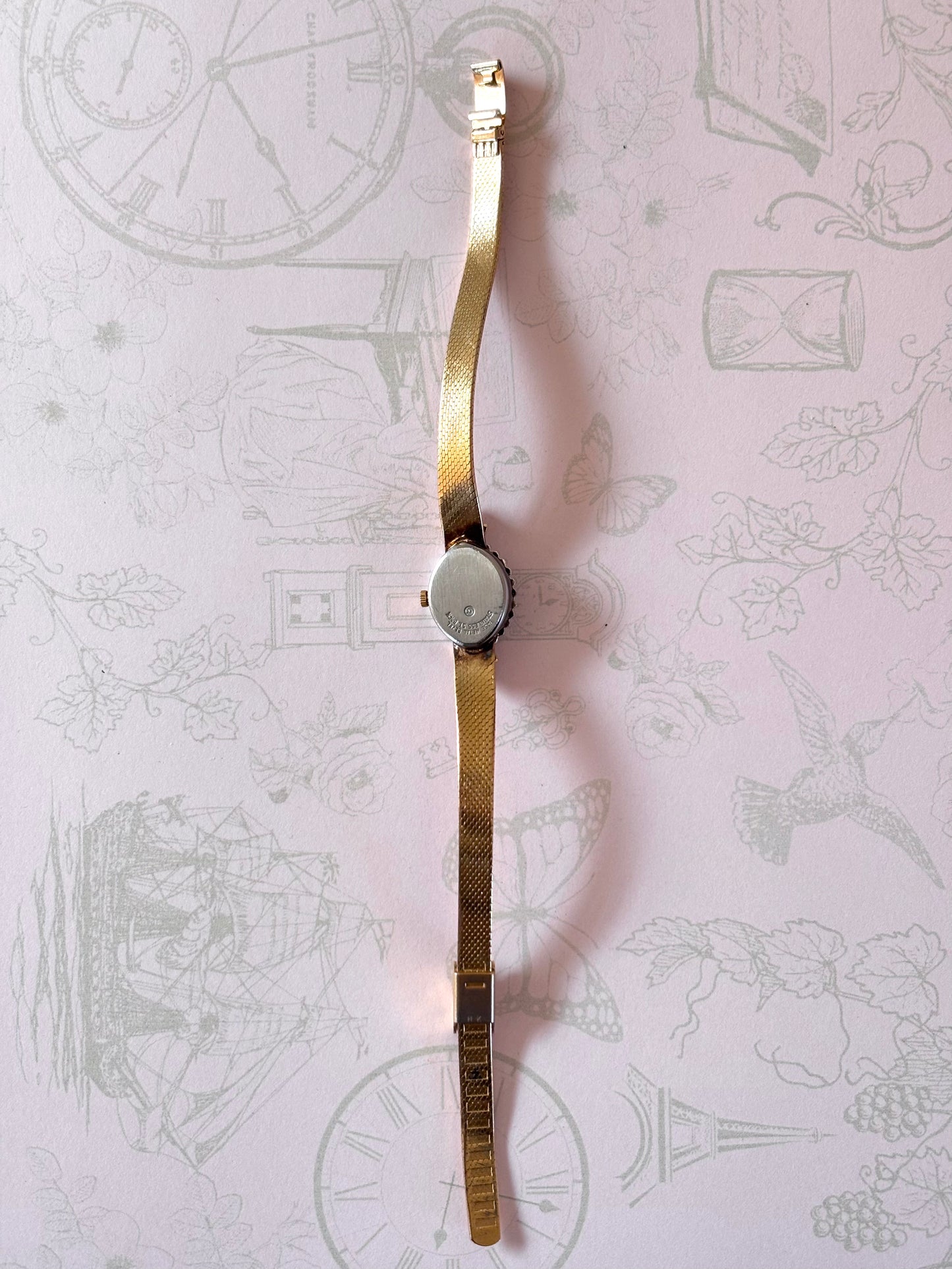 Vintage Gold Toned Watch with Purple Accents