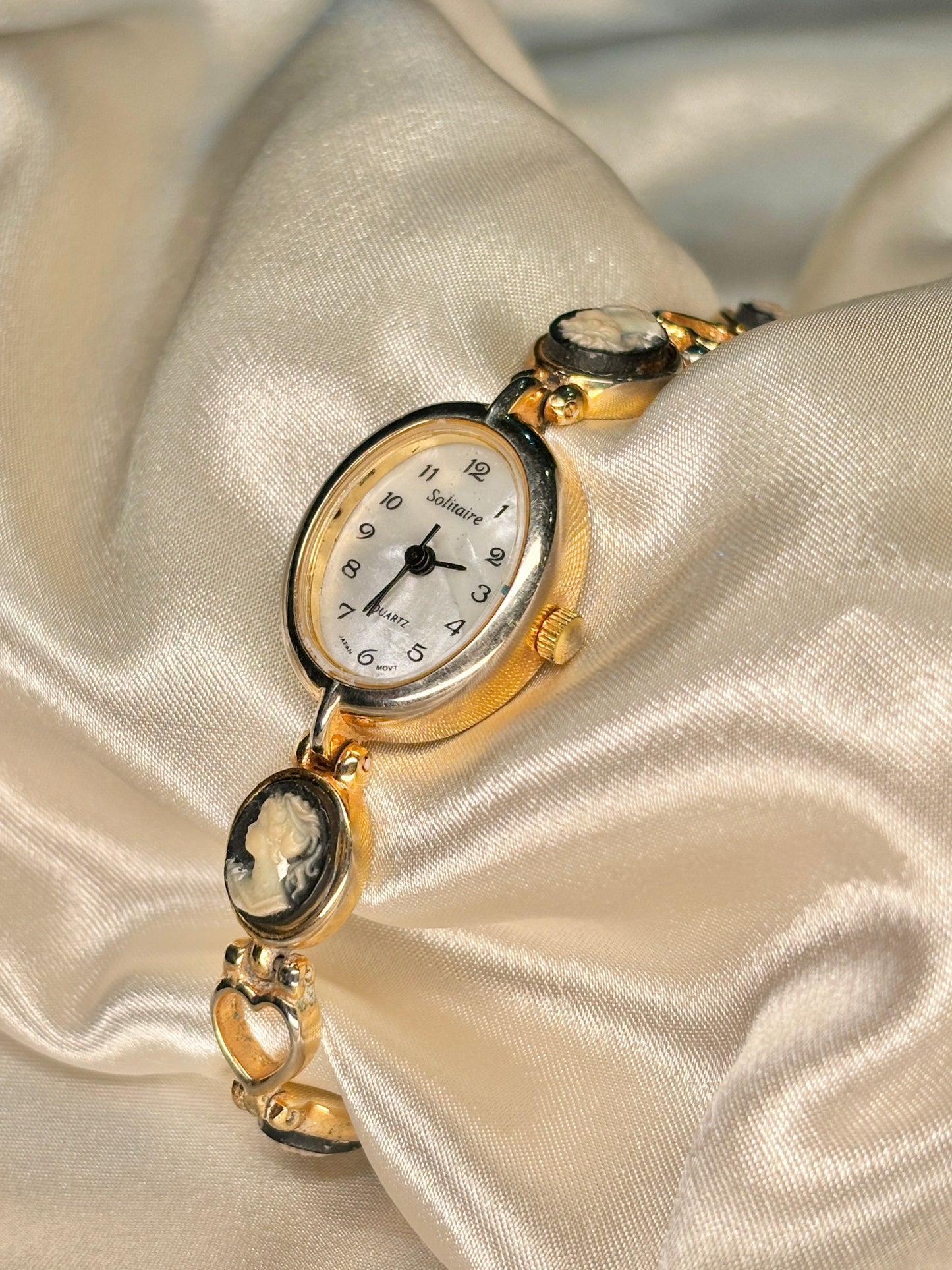 Cameo Gold Tone Solitaire Watch with Hearts